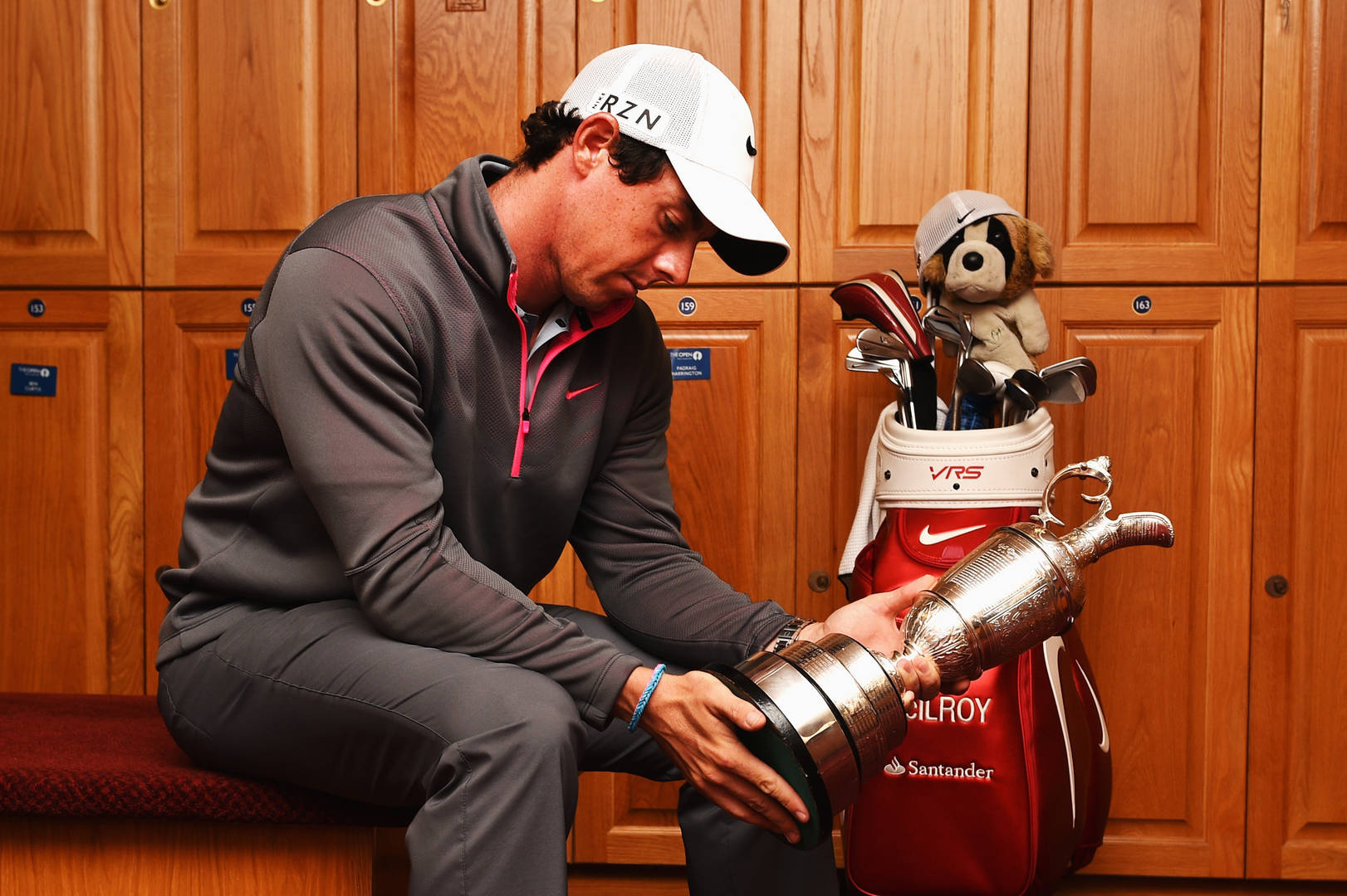 Rory McIlroy inspects the historic Claret Jug after victory in 2014